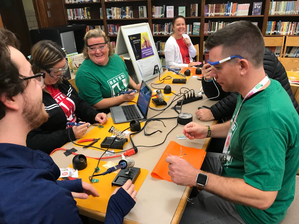 teachers working together in a library