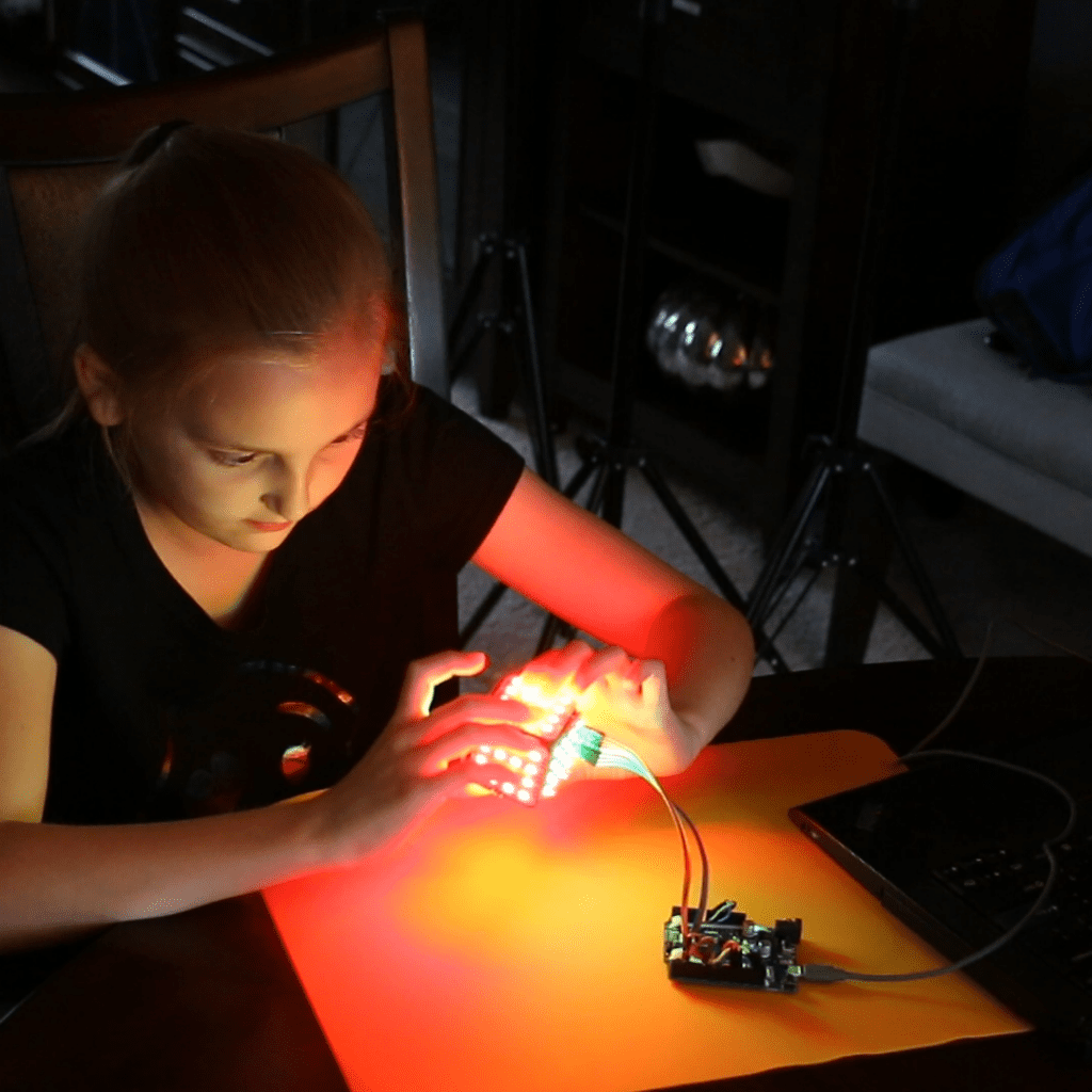 girl building stem subscription box project