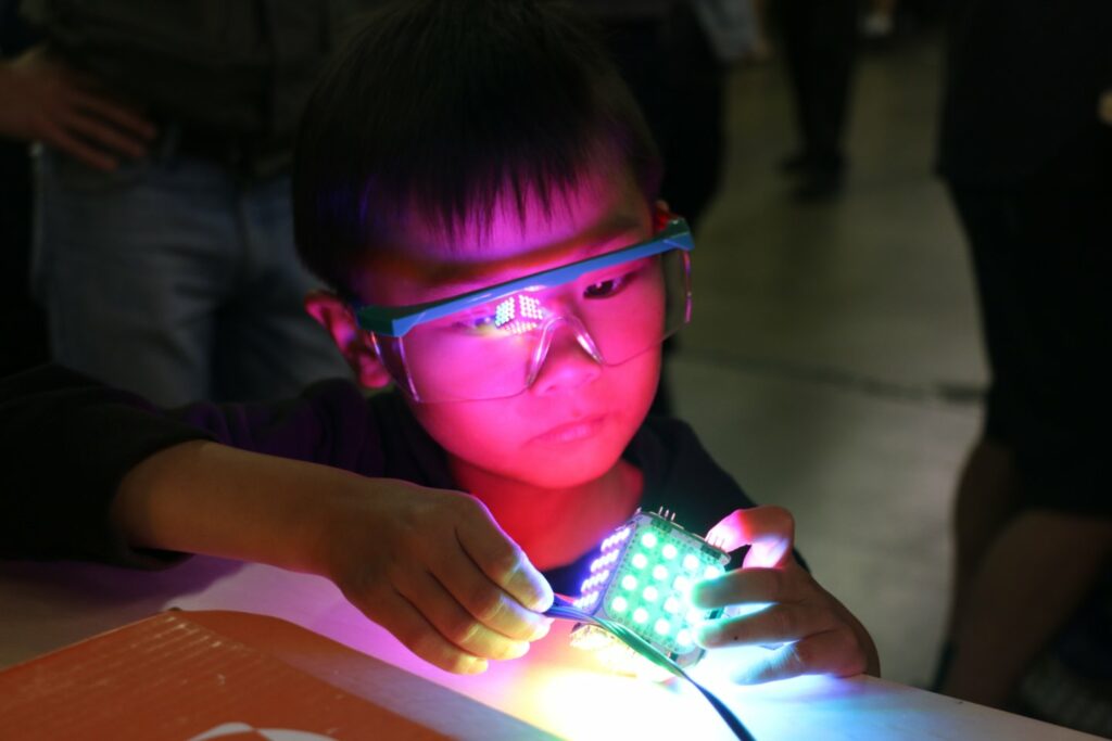 kid playing with robot